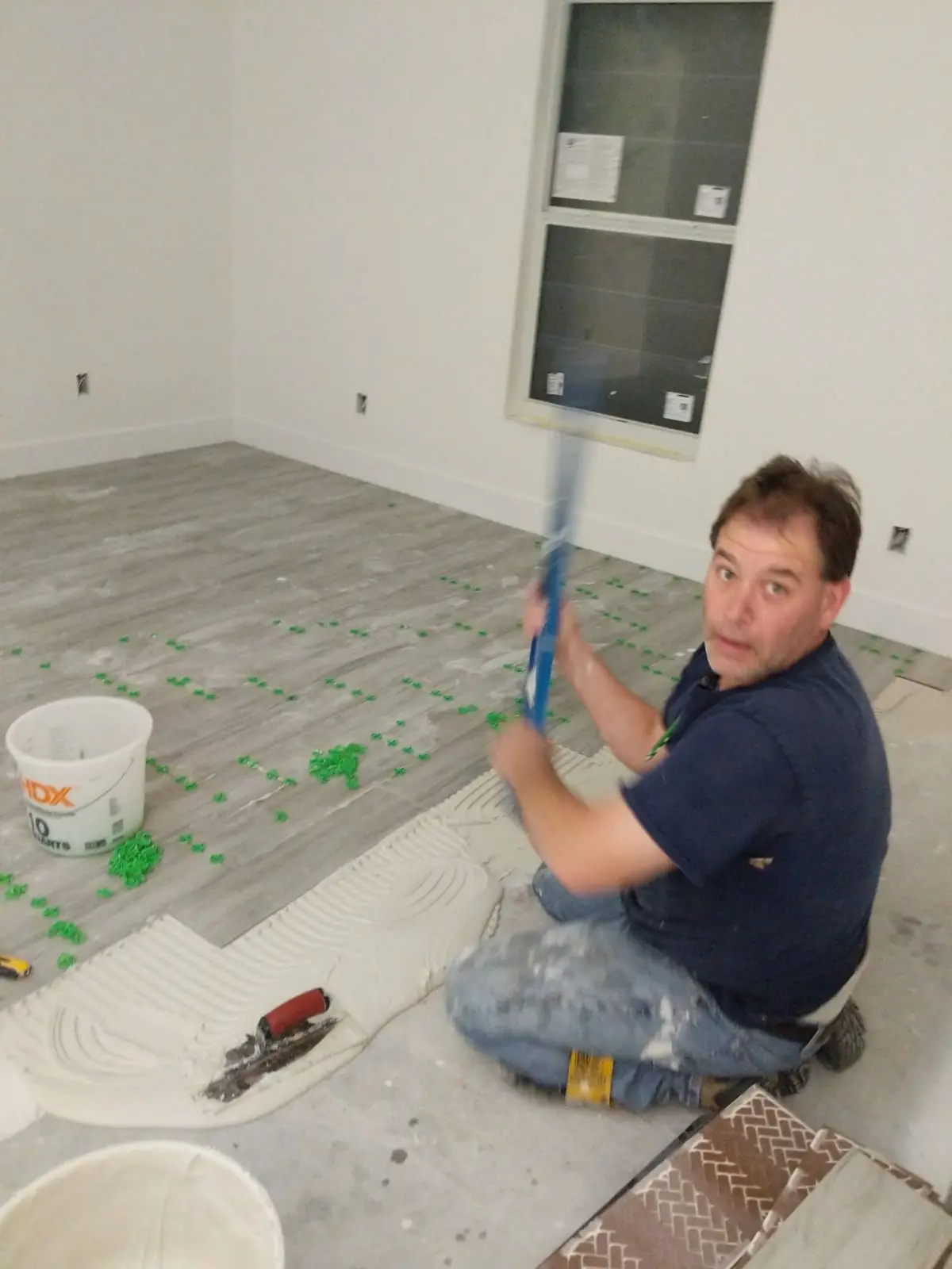Shaun the tile guy setting a floor in Southwest Florida