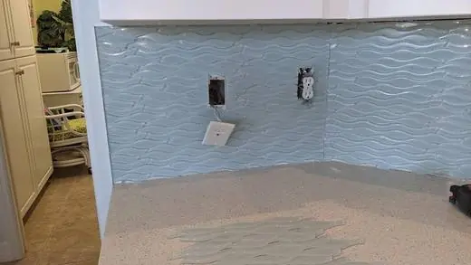Blue wave-pattern glass backsplash