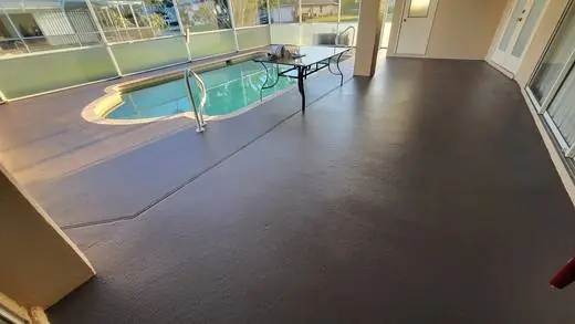 Pool deck resurfaced with a dark coating
