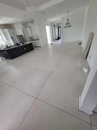 Open-plan great room in large-format porcelain tile