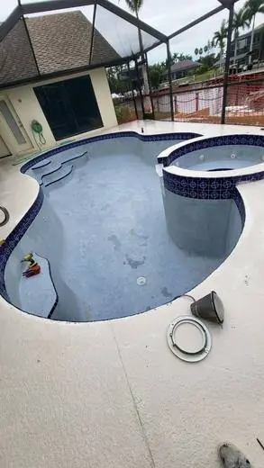 Pool and spa with a cobalt tile band