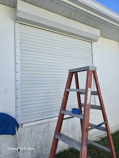 Roll-down hurricane shutter installation