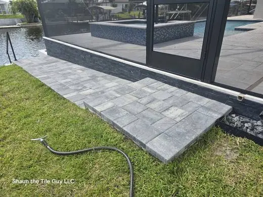 Stacked slate and glass mosaic pool raised wall